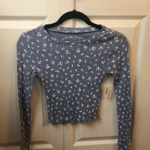 Blue long sleeve shirt with white flowers